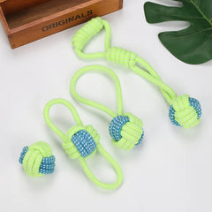 Four Interactive Cotton Rope Dog Toys in bright green and blue, designed for playful engagement, arranged on a light backdrop.